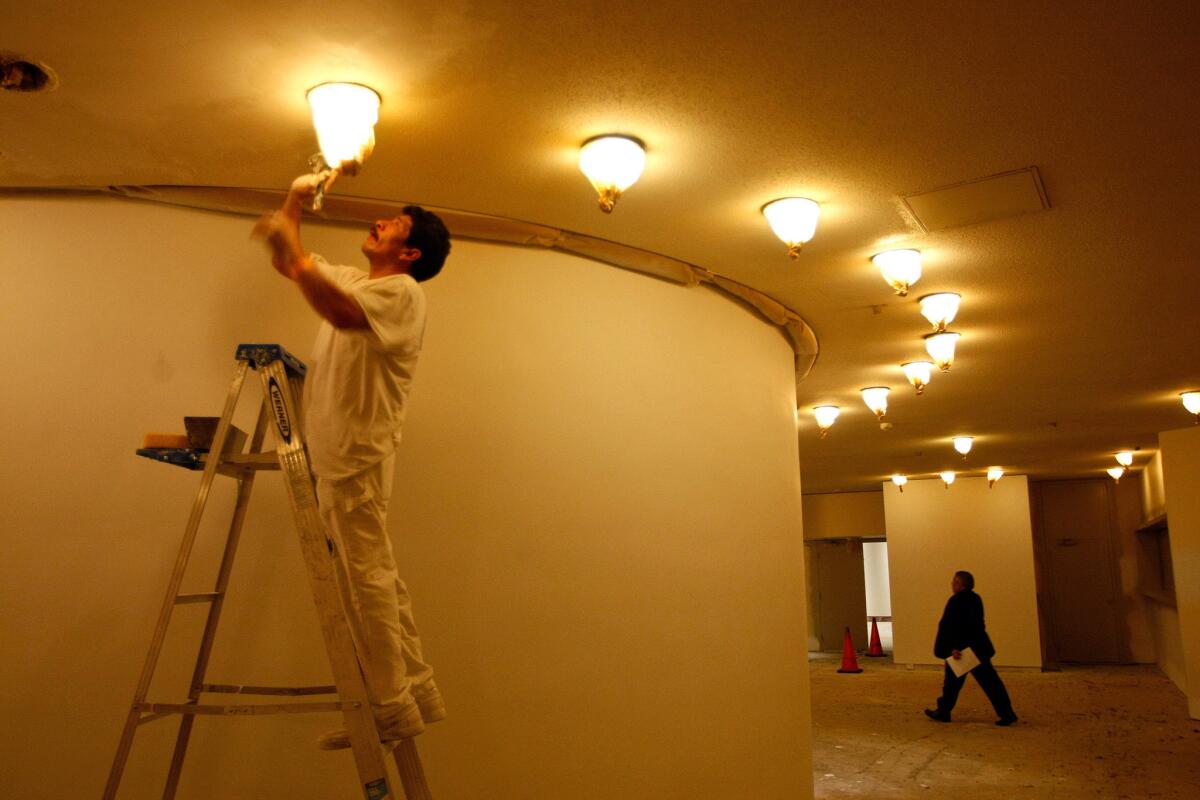 Jose Luis works on drywall inside the foyer of the Pasadena Ballroom of the Westin Bonaventure Hotel in downtown Los Angeles in 2010. Hotels across the country are expected to spend a record $6 billion on upgrades in 2014.