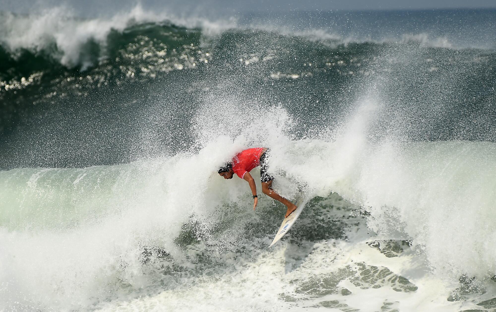 Surfer Bryan Perez rides a wave