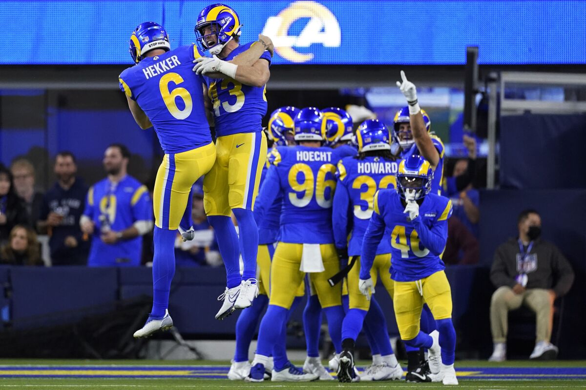 Rams punter Johnny Hekker celebrates with teammates after pinning the Cardinals deep in their territory 