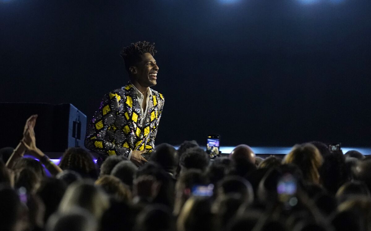 Jon Batiste is seen in the audience before going on stage to accept the award for best music video for "Freedom" at the 64th Annual Grammy Awards on Sunday, April 3, 2022, in Las Vegas. (AP Photo/Chris Pizzello)