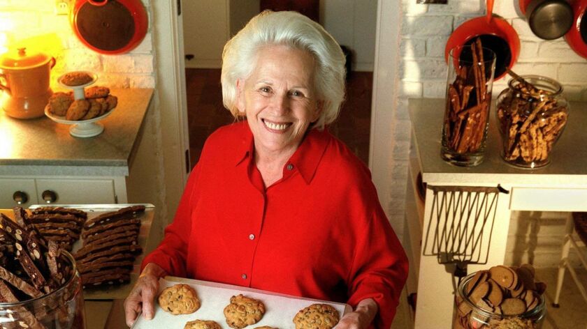 Maida Heatter, the country's foremost creator of desserts and writer of dessert cookbooks, displays a tray of cookies.
