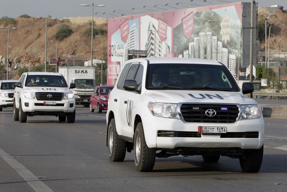A convoy of a U.N. team of weapons inspectors, who concluded its almost week-long mission in Syria, arrive at Rafik Hariri international airport in Beirut on Monday -- the same day that inspectors from the Organization for the Prohibition of Chemical Weapons were arriving on their way into Syria.