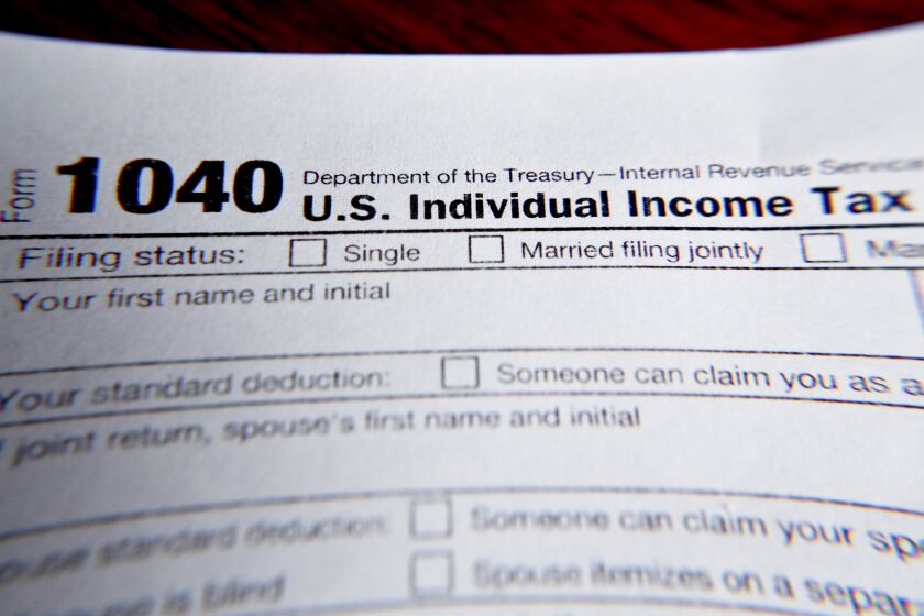 FILE - This Wednesday, Feb. 13, 2019 file photo shows part of a 1040 federal tax form printed from the Internal Revenue Service website, in Zelienople, Pa. Health insurance shoppers who used tax credits to buy coverage in 2020 still have a few weeks left to ward off an unpleasant tax surprise next spring. (AP Photo/Keith Srakocic)