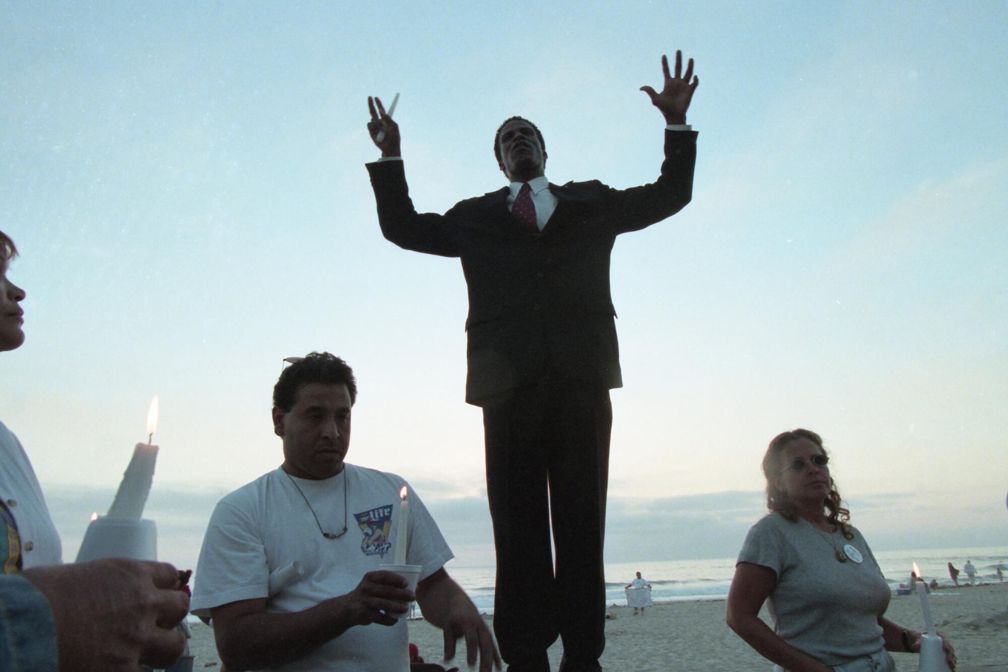 Scenes of a vigil and protest of the fatal police shooting of Demetrius DuBois in 1999