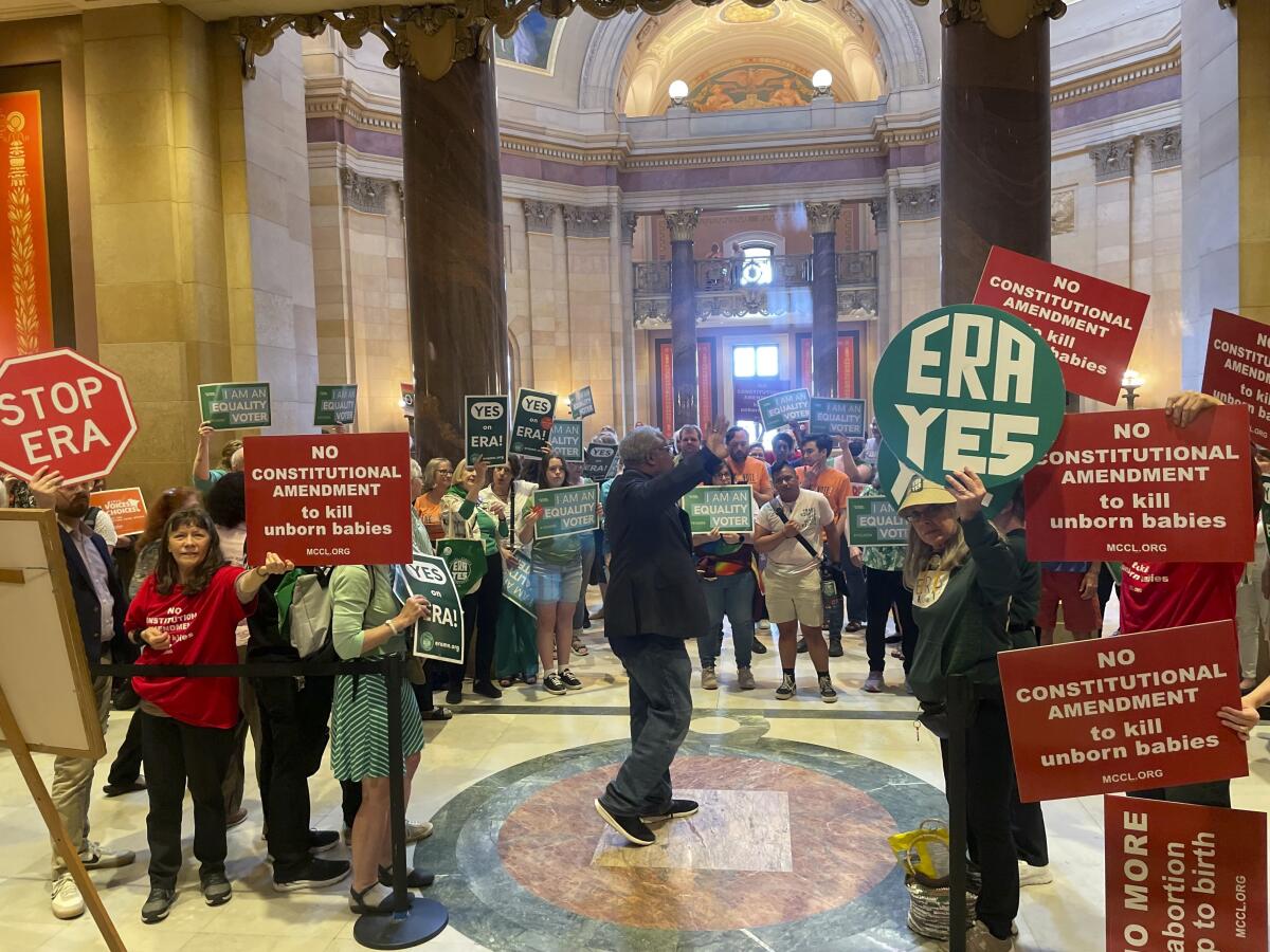 Supporters and opponents of the Minnesota Equal Rights Amendment at the State Capitol building in St. Paul, Minn.
