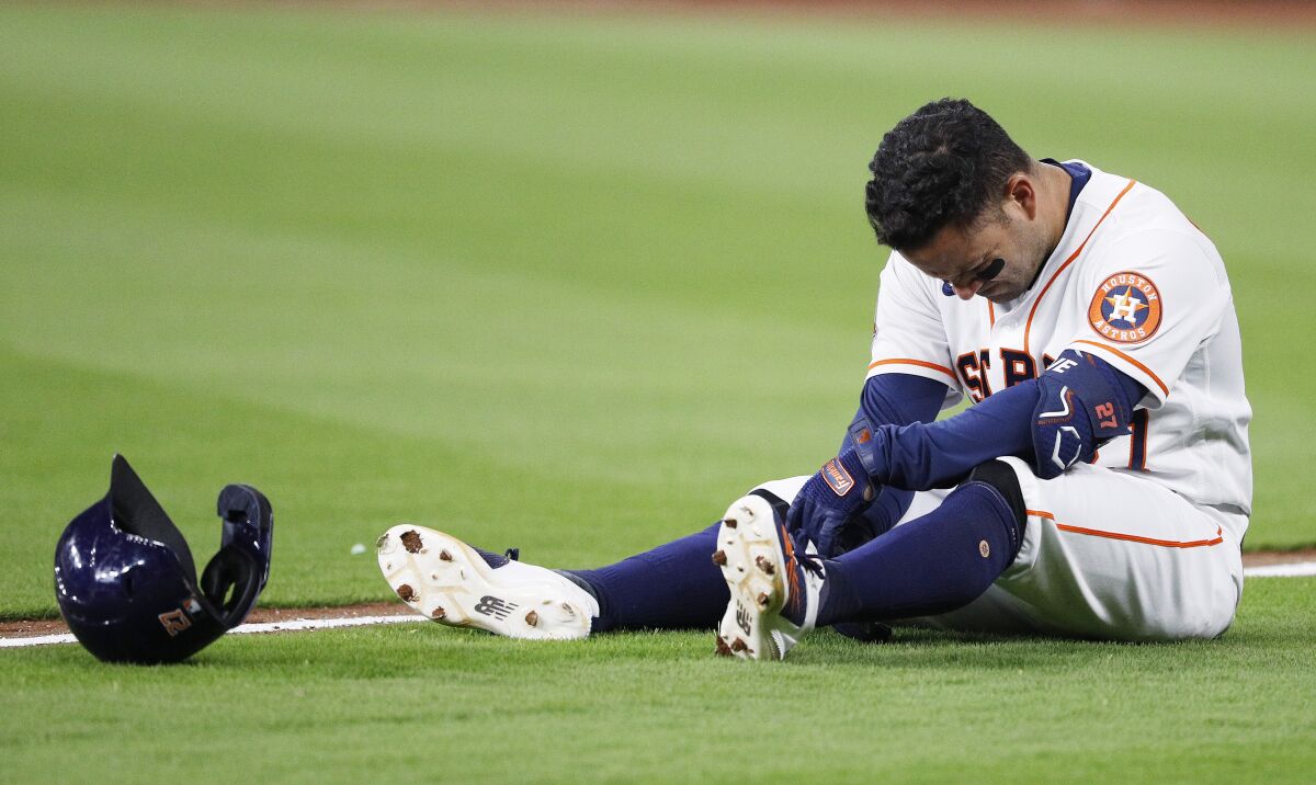 Houston Astros' Jose Altuve reacts after legging out an infield single in the bottom of the eighth inning against the Los Angeles Angels, Monday, April 18, 2022, in Houston. (Kevin M. Cox/The Galveston County Daily News via AP)