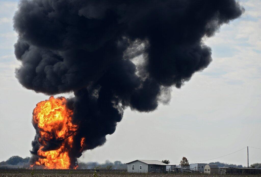 A ball of fire burns in field in Milford, Texas, following the explosion of a gas pipeline.