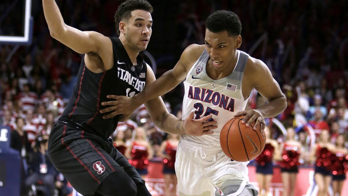 Arizona guard Allonzo Trier tries to drive past Stanford guard Dorian Pickens during the second half Wednesday night.