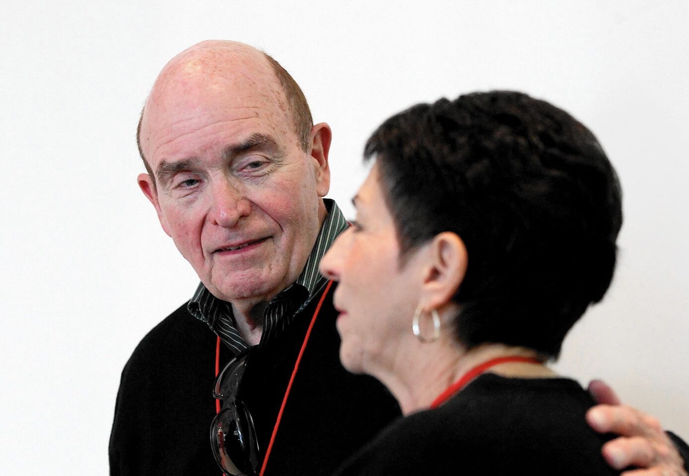Heart patient Kenneth Keefe and his wife Silvia, of Huntington Beach, talk about the new heart valve that saved his life during Edward Lifesciences Patient Day on Friday in Irvine.