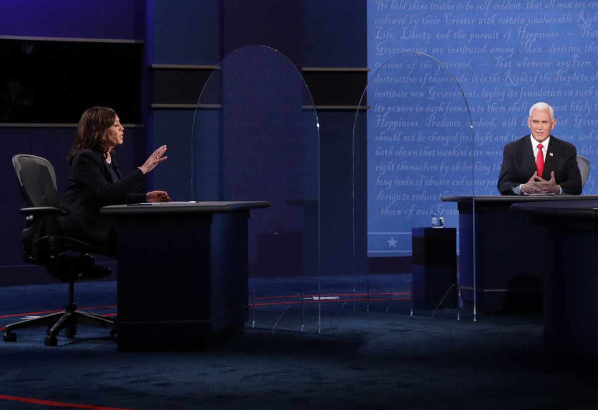 Sen. Kamala Harris and Vice President Mike Pence on the debate stage 