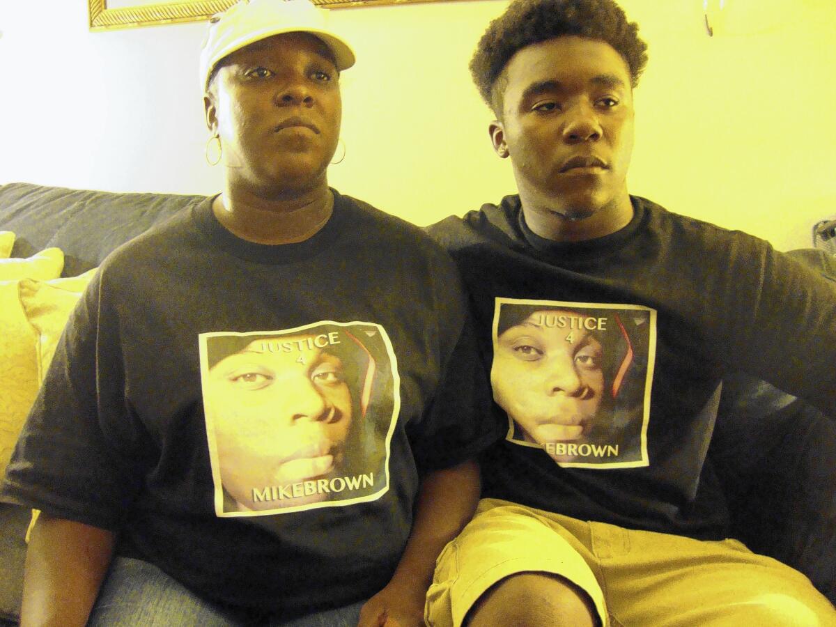 Michael Brown's cousin Christine Ewings, left, and her son Daryus Watson, 16.