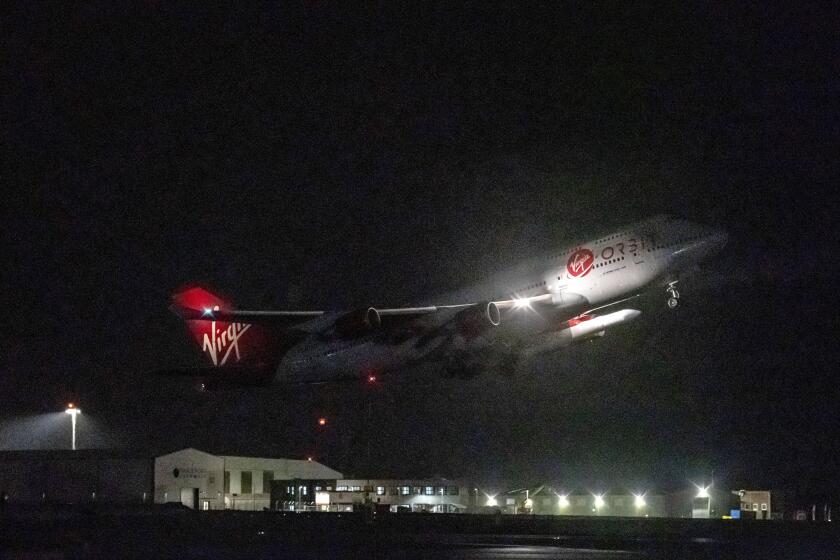 Virgin Atlantic's Cosmic Girl, carrying Virgin Orbit's LauncherOne rocket, takes off from Spaceport Cornwall