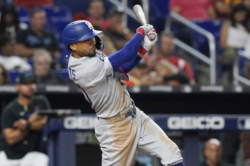 Los Angeles Dodgers' Mookie Betts (50) hits a two-run home run in the seventh inning.
