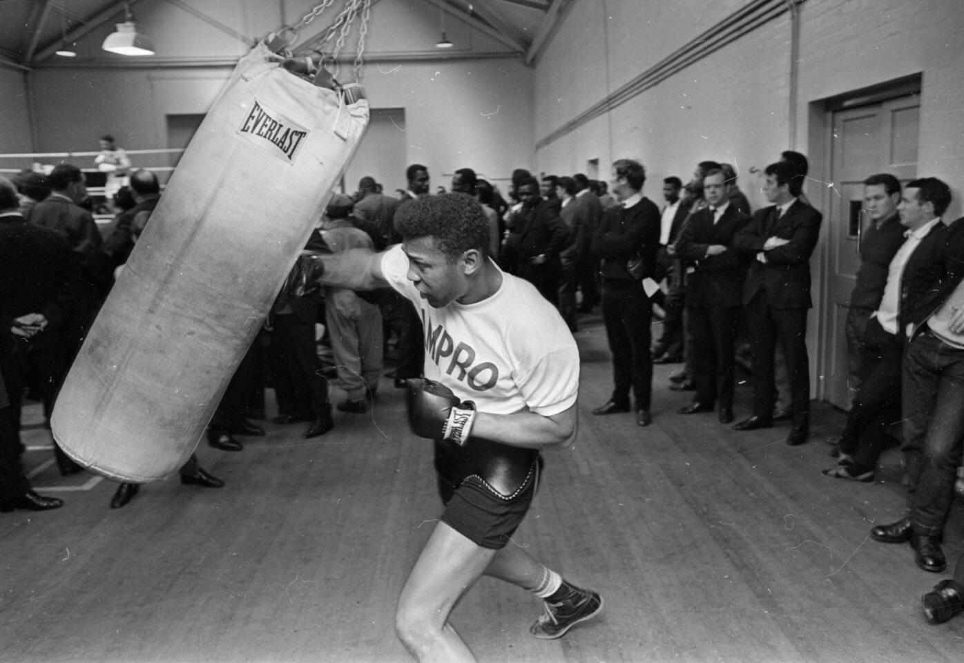 Ex-boxing champion Jimmy Ellis, seen here in 1966, died on May 7, 2014, at the age of 74. He was a onetime sparring partner for Muhammad Ali.