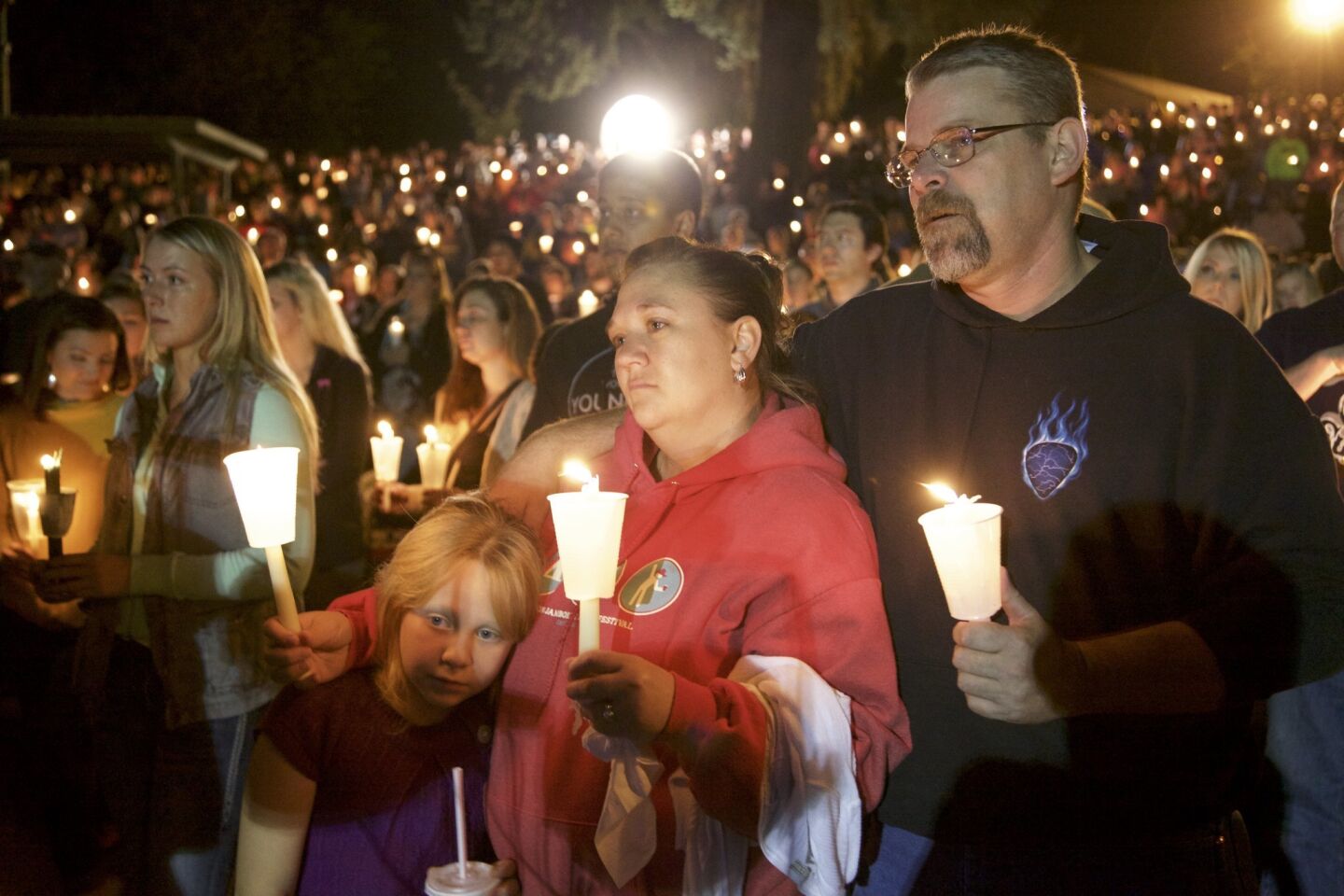 Residents of Roseburg, Ore., hold a candlelight vigil for victims of the shooting at Umpqua Community College on Oct. 1.