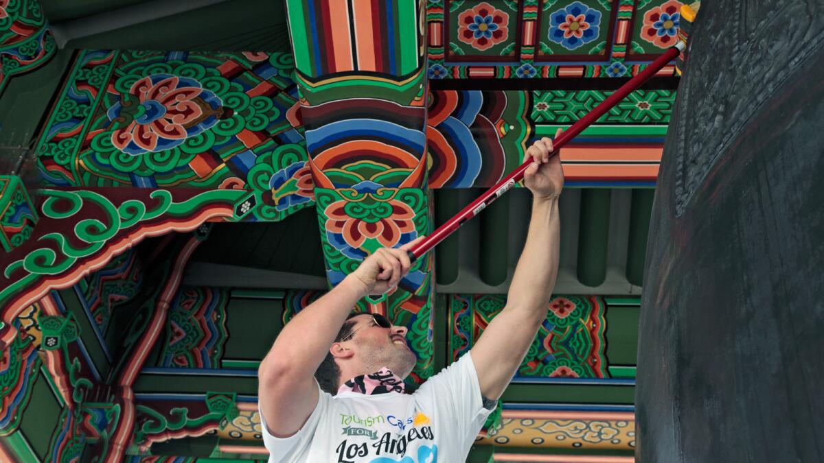 A volunteer from Tourism Cares cleaned up the Korean Bell in San Pedro last year. It was part of a multi-day campaign to show some love to L.A.'s landmarks in need.