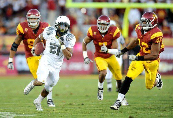 Oregon running back LaMichael James breaks into the clear on a 43-yard touchdown run against USC defenders (from left) Wes Horton, T.J. McDonald and Devon Kennard in the first quarter Saturday.