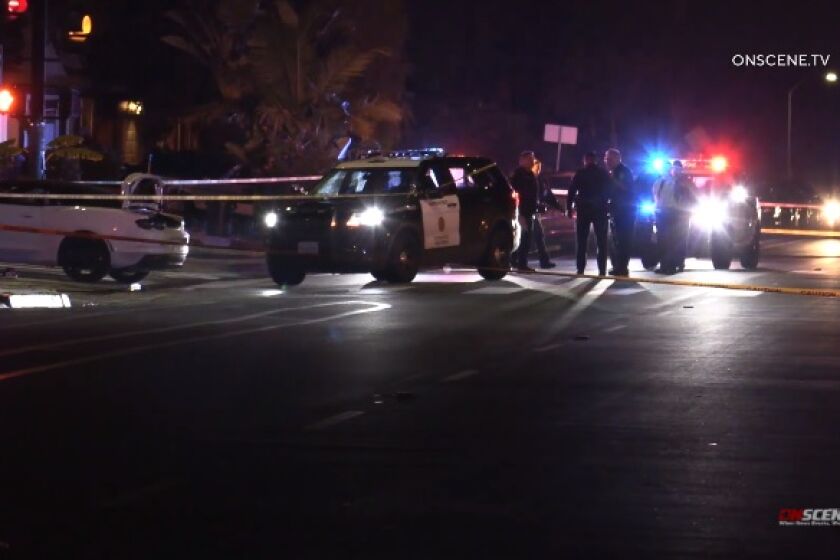 San Diego police officers investigate a fatal shooting late Thursday at Palm and Twining avenues in Otay Mesa.