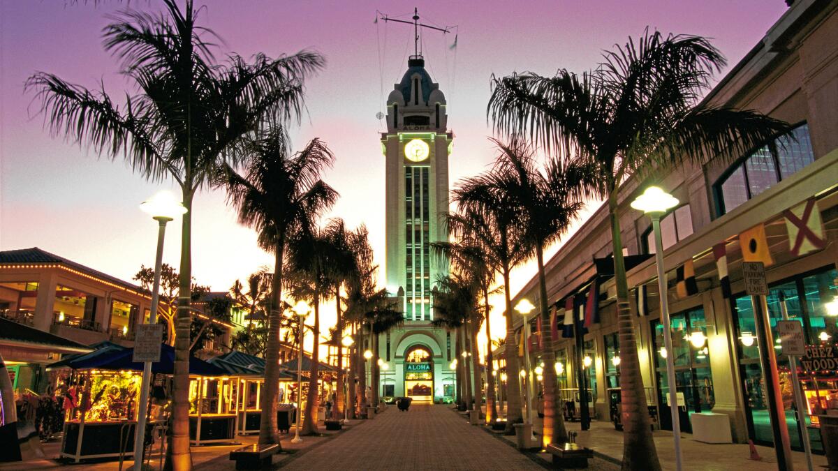 View of the Aloha Tower at dusk in Honolulu. Allegiant is offering a round-trip fare for less than $300 for winter travel.