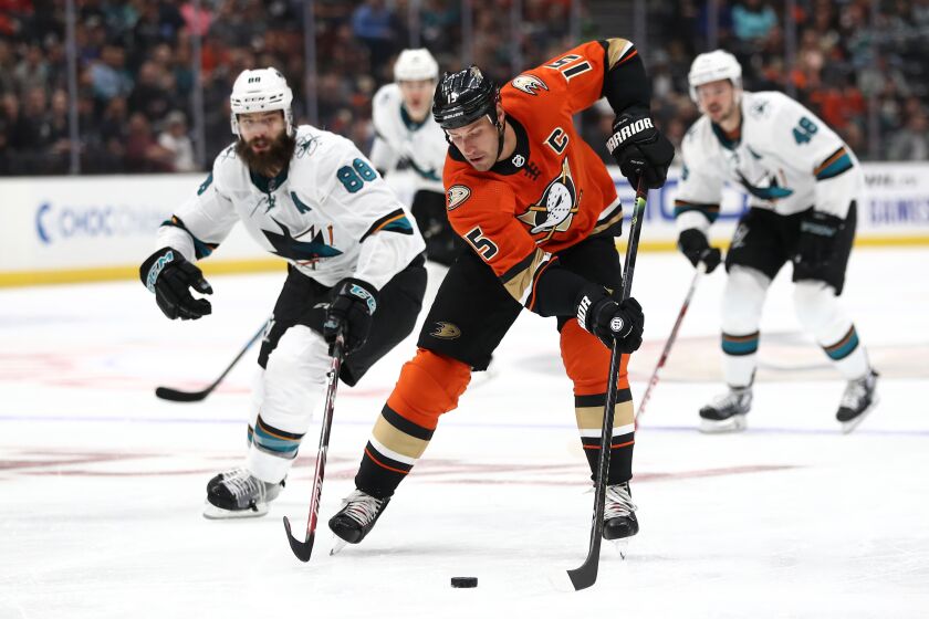ANAHEIM, CALIFORNIA - OCTOBER 05: Ryan Getzlaf #15 of the Anaheim Ducks controls the puck past Brent Burns #88 of the San Jose Sharks during the third period of a game at Honda Center on October 05, 2019 in Anaheim, California. (Photo by Sean M. Haffey/Getty Images) ** OUTS - ELSENT, FPG, CM - OUTS * NM, PH, VA if sourced by CT, LA or MoD **