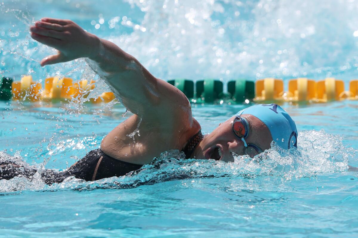 CdM junior Milan Bever competes in the girls' 200 freestyle during Friday's Surf League swim finals. 