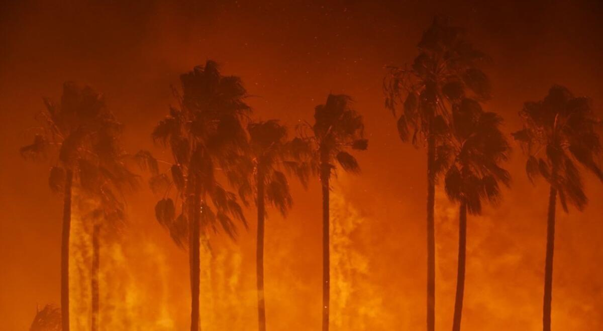 A fast-moving, wind-driven wildfire swept into the city of Ventura early Tuesday, burning 50,000 acres, destroying homes and forcing more than 27,000 people to evacuate.