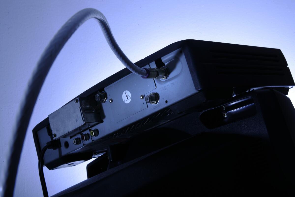 The rear of a cable box is seen sitting atop a television in Philadelphia in May 2007. Federal Communications Commission Chairman Tom Wheeler has proposed a rule that could eliminate the need for cable and satellite converter boxes.