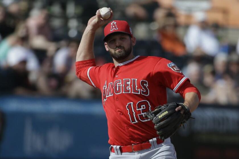 Angels second baseman fields a ball during a spring training game against the San Francisco Giants on March 3.