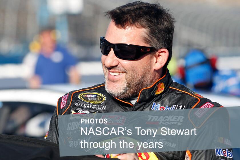NASCAR Sprint Cup driver Tony Stewart smiles during qualifying at Phoenix International Raceway on March 13, 2015.