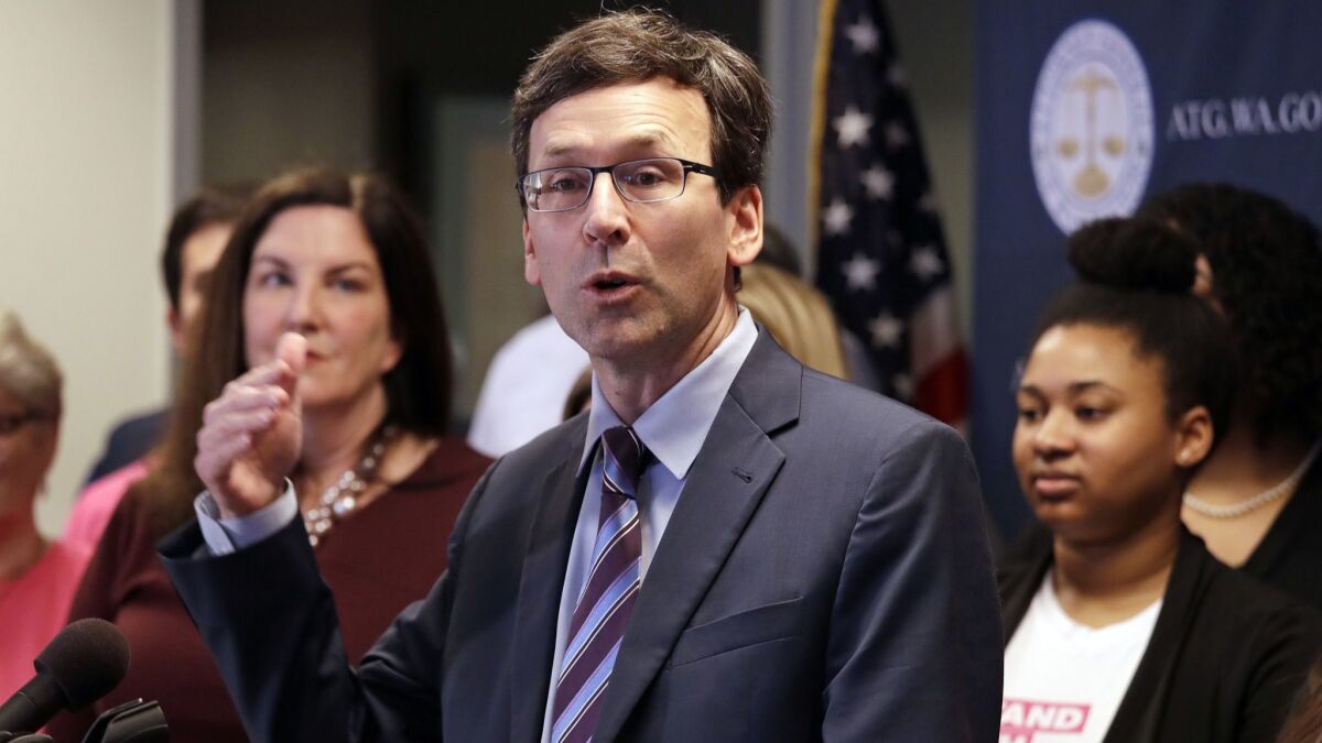 Washington state Atty. Gen. Bob Ferguson speaks at a Seattle news conference announcing a lawsuit challenging the Trump administration's Title X "gag rule" on Feb. 25.