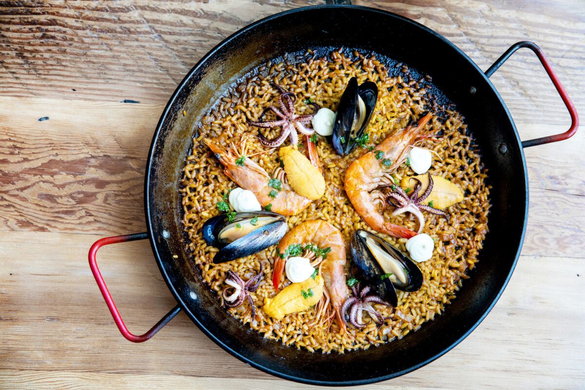 The Mariscos paella, with prawns, mussels, squid, lobster fumet and sherry aioli, at Otoño in Highland Park.