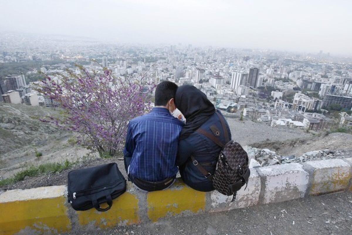 An Iranian couple enjoy some togetherness in north Tehran's mountainous area.