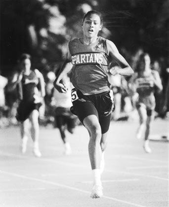 Marion Jones, competing for Rio Mesa High School in Oxnard, sprints toward the finish line in a race at Cerritos College in Norwalk. She won the California state championship in the 100 meters four consecutive years while at Rio Mesa and Thousand Oaks high schools.