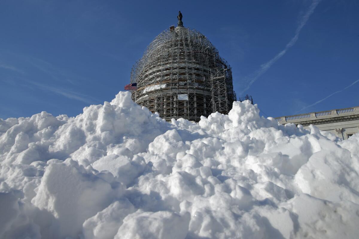A pile of shoveled snow stands in the plaza on the east side of the U.S. Capitol on Thursday.