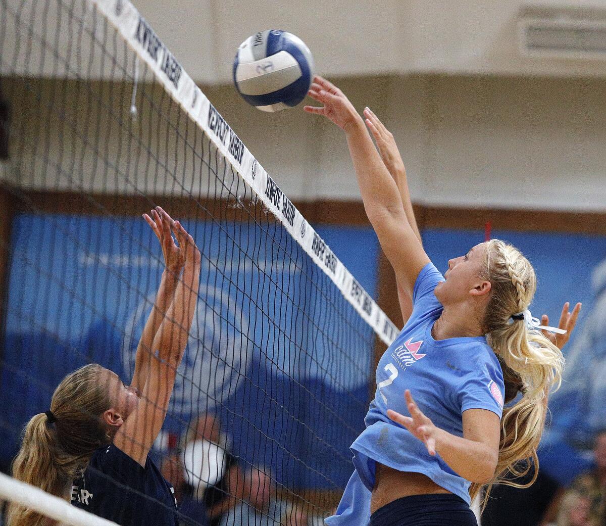Nikki Senske hits the ball back for a point in a Sunset Conference crossover match at Newport Harbor on Thursday.