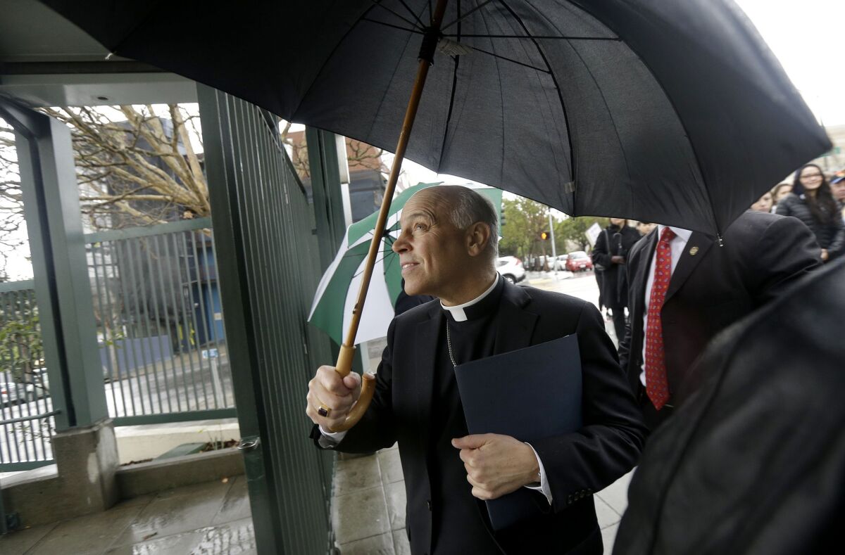 Salvatore Cordileone, the Roman Catholic archbishop of San Francisco, walks through a gate to Sacred Heart Cathedral Preparatory School on Feb. 6.