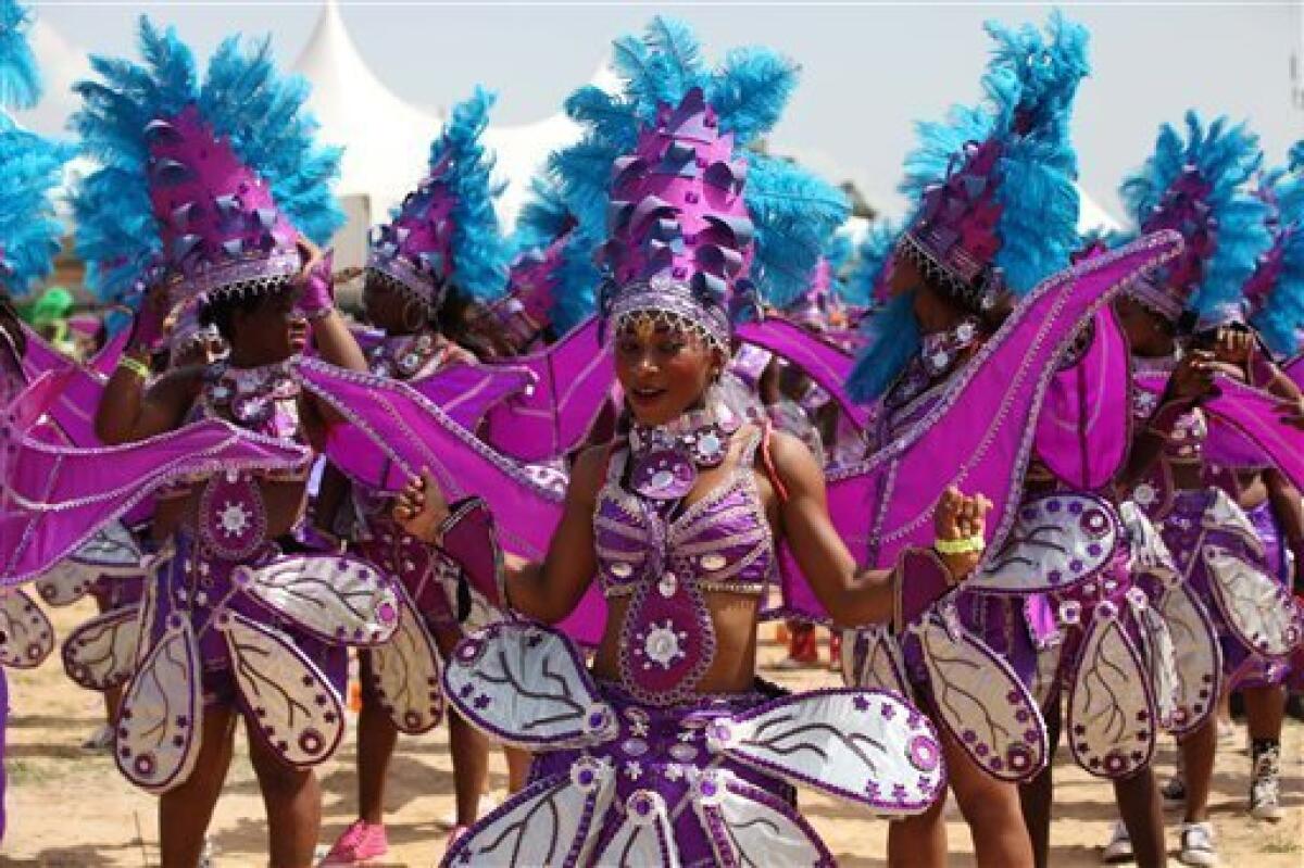 Performers dance during Lagos Carnival in Lagos, Nigeria, Monday, April 1, 2013. Performers filled the streets of Lagos' islands Monday as part of the Lagos Carnival, a major festival in Nigeria's largest city during Easter weekend. (AP Photo/Sunday Alamba)