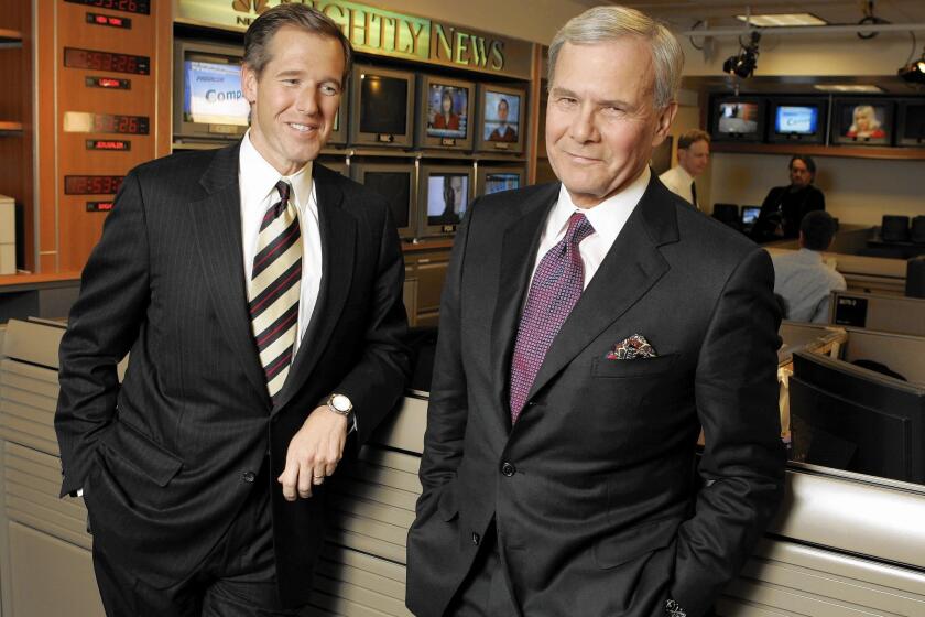 NBC Nightly News anchor Tom Brokaw, right, and his successor Brian Williams, before Brokaw's last broadcast on Dec. 1, 2004.