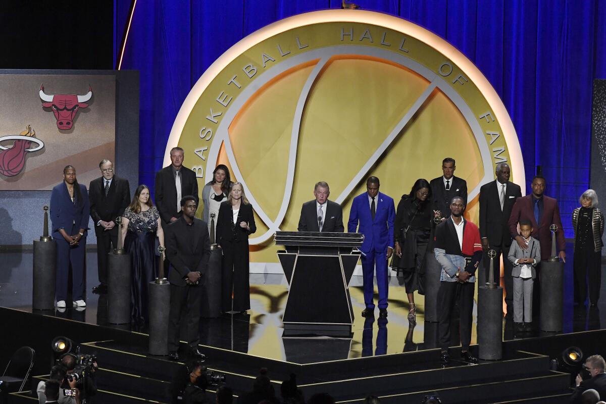 The class of 2021 Basketball Hall of Fame stands together on stage, Saturday, Sept. 11, 2021, in Springfield, Mass. (AP Photo/Jessica Hill)