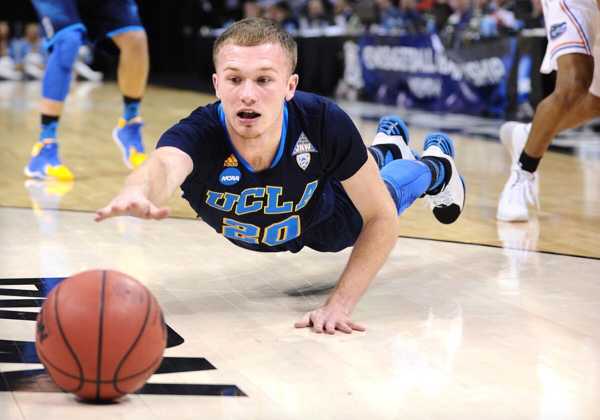 Bruins guard Bryce Alford dives for a loose ball against Florida in the first half Thursday night in Memphis, Tenn.