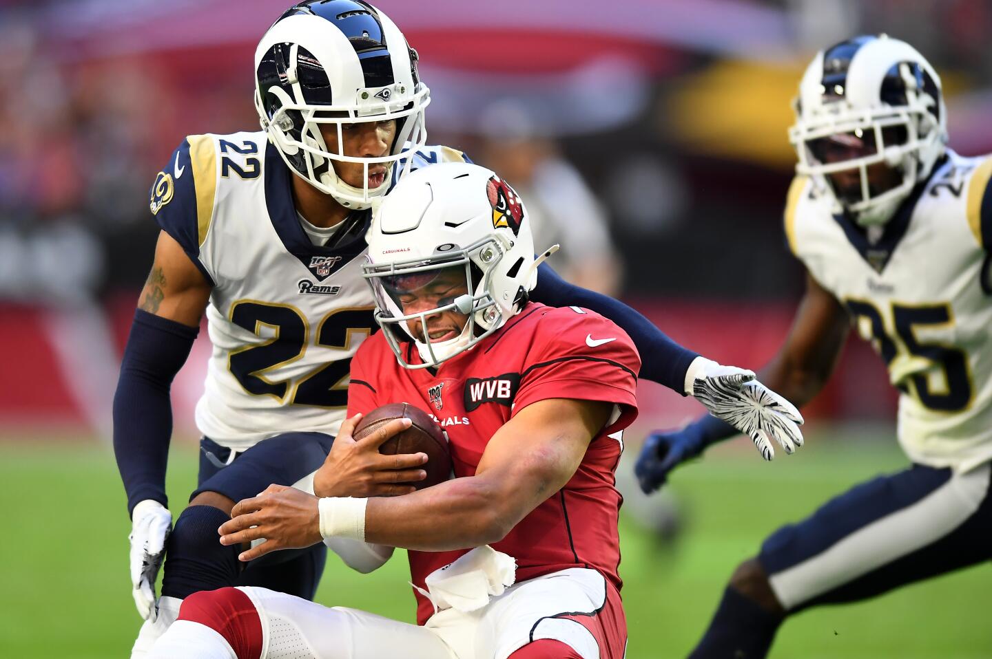 Arizona Cardinals quarterback Kyler Murray is tackled by Rams cornerback Troy Hill.