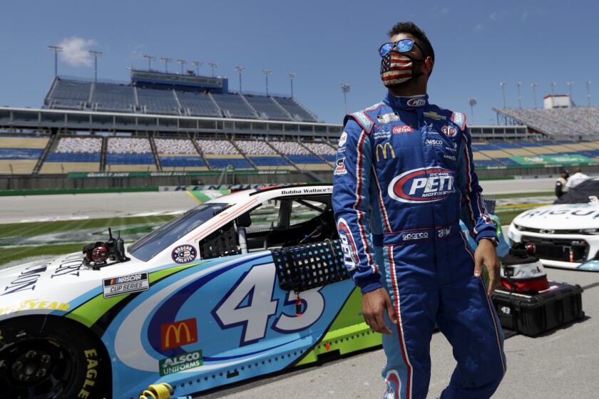 Bubba Wallace (43) waits for the start of a NASCAR Cup Series auto race Sunday, July 12, 2020, in Sparta, Ky. (AP Photo/Mark Humphrey)