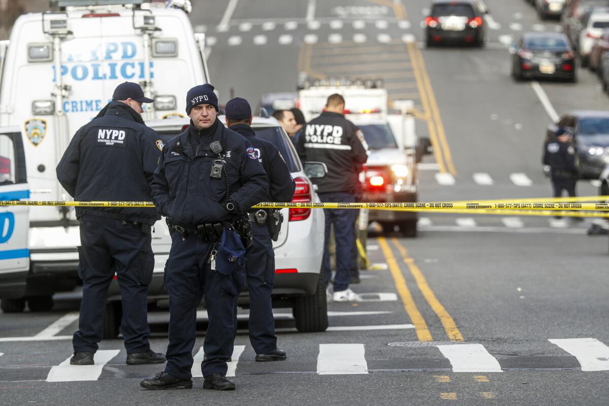 New York City police officers at the scene of a police-involved shooting.