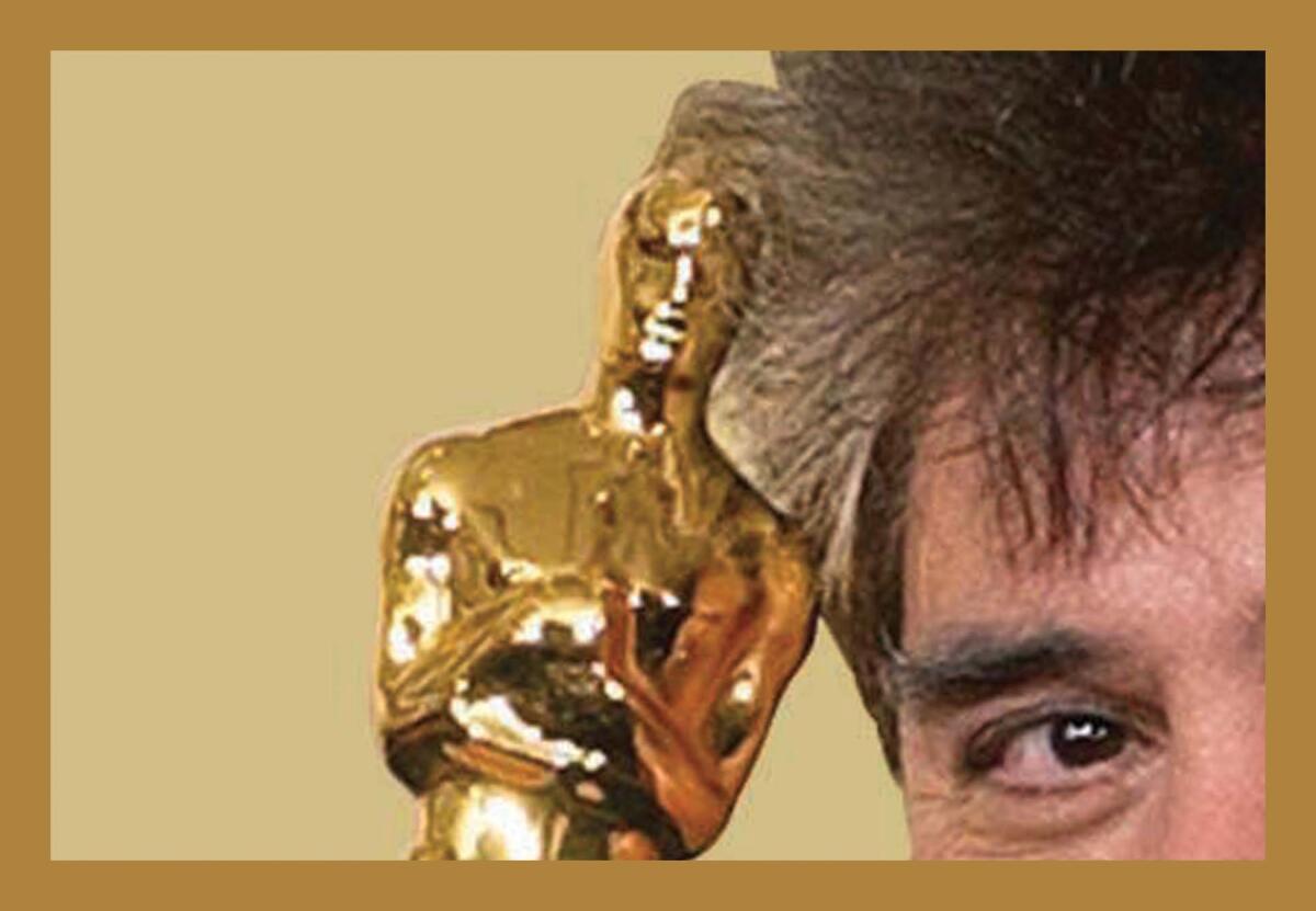 A zoomed in shot of an Oscar a man is holding up to his face 
