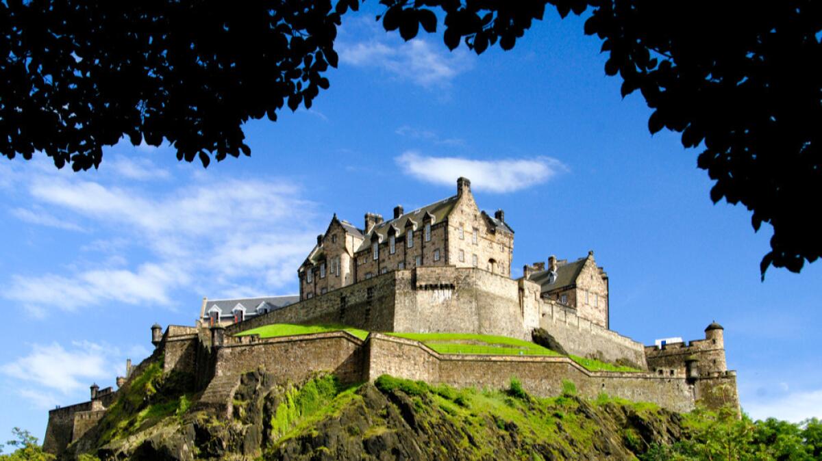 Edinburgh Castle is a fortress that dominates the skyline of Edinburgh, Scotland, from its position atop the volcanic Castle Rock.
