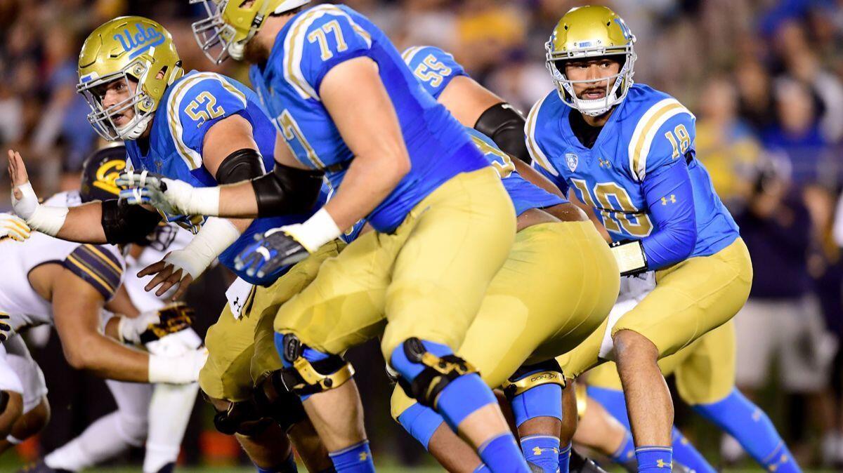 UCLA's Devon Modster (18) takes a snap during the third quarter against California at the Rose Bowl on Nov. 24.
