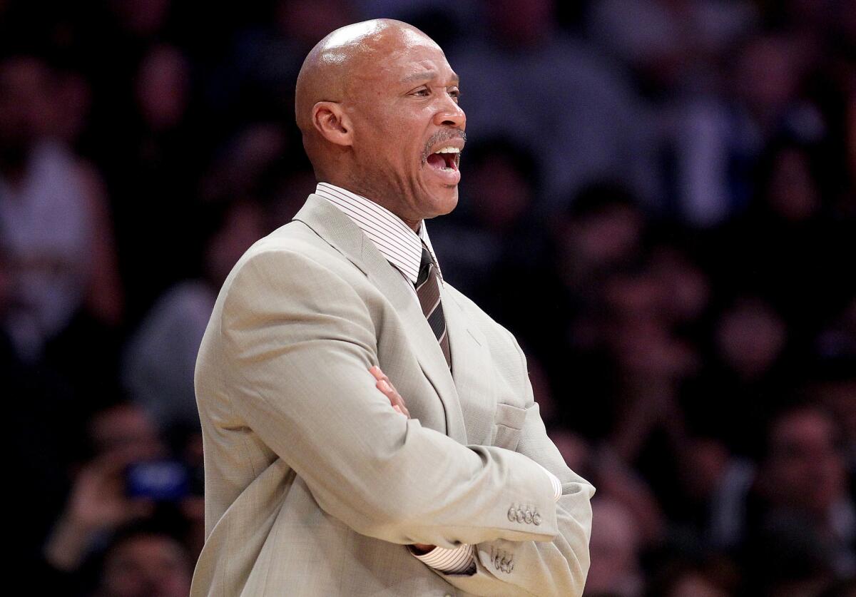 Lakers Coach Byron Scott shouts instructions to his players during the second half of a loss to the Miami Heat, 78-75, at Staples Center.