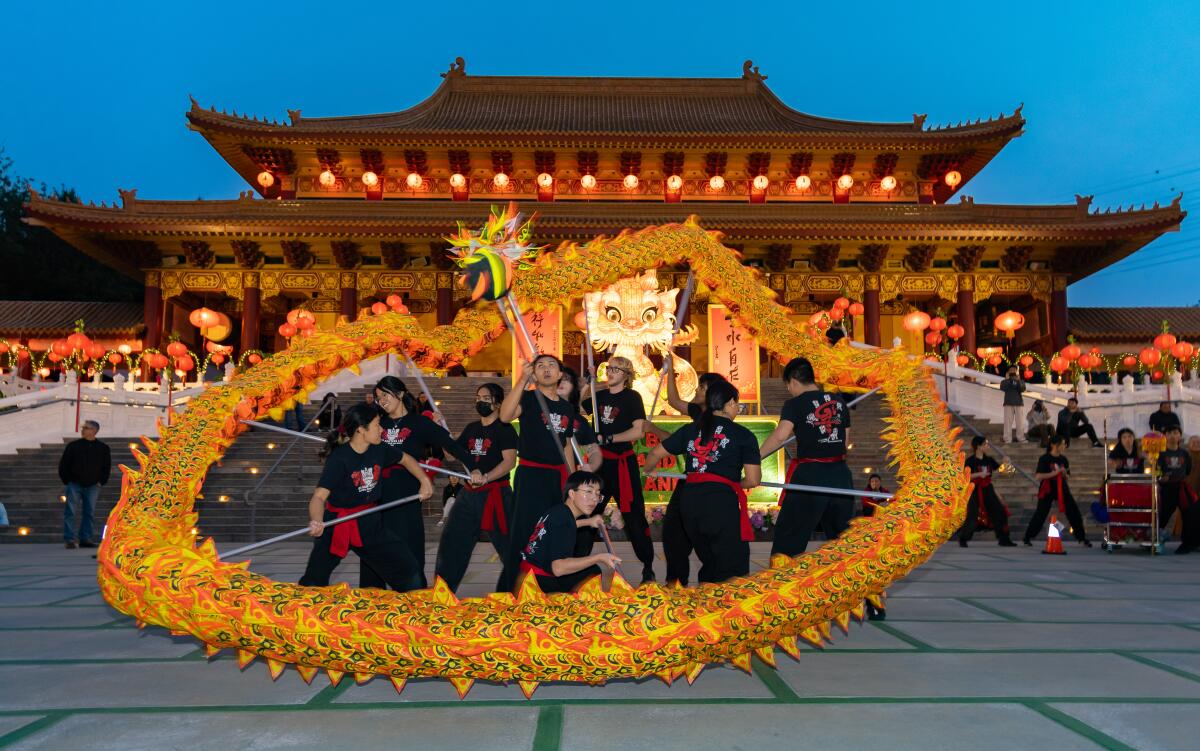 Performers from Gio Nam Mua Lan perform a dragon dance at the Hsi Lai Temple in Hacienda Heights.
