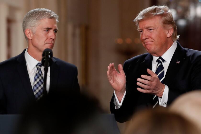 President Donald Trump applauds as he stands with Judge Neil Gorsuch in the East Room of the White House after announcing Gorsuch as his nominee for the Supreme Court Jan. 31.