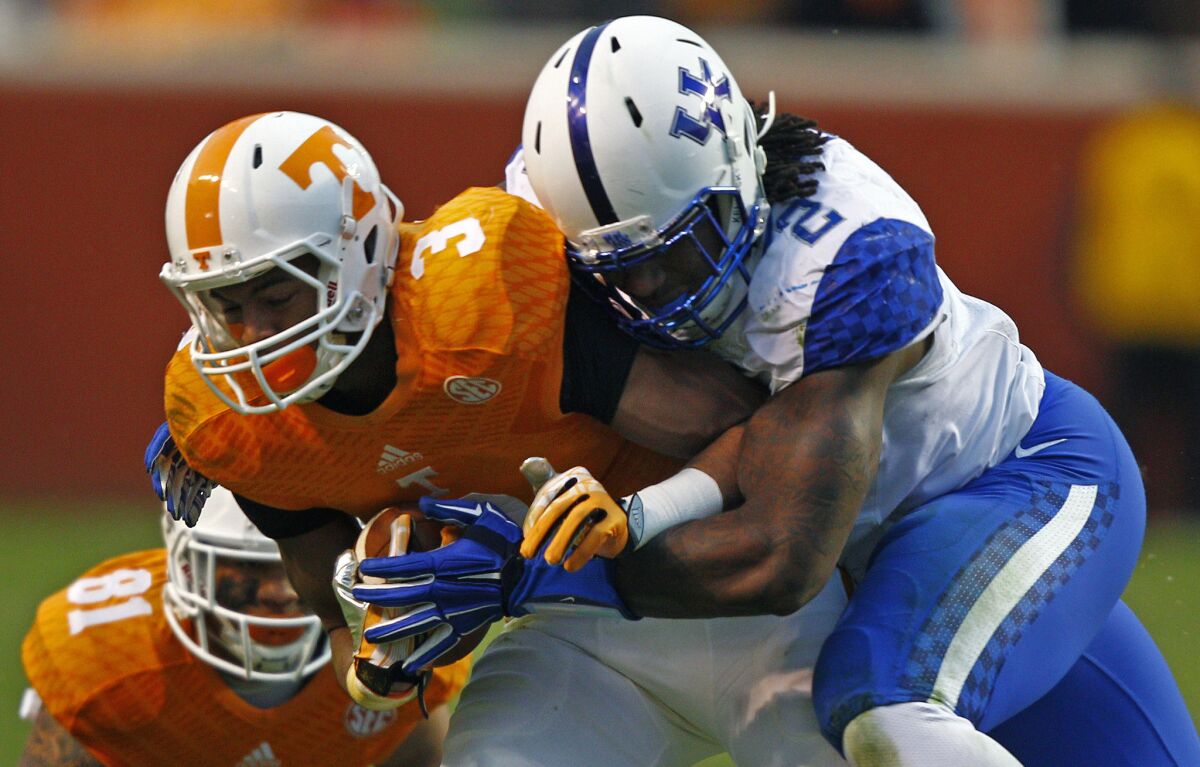 Kentucky defensive end Alvin Dupree tackles Tennessee reciever Josh Malone during a game Nov. 15.